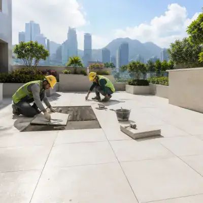 Terrace tiling laid on a Dubai rooftop with skyline behind