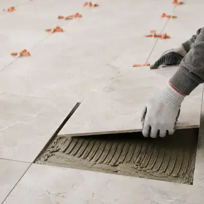 Replacing a cracked floor tile in a Dubai apartment